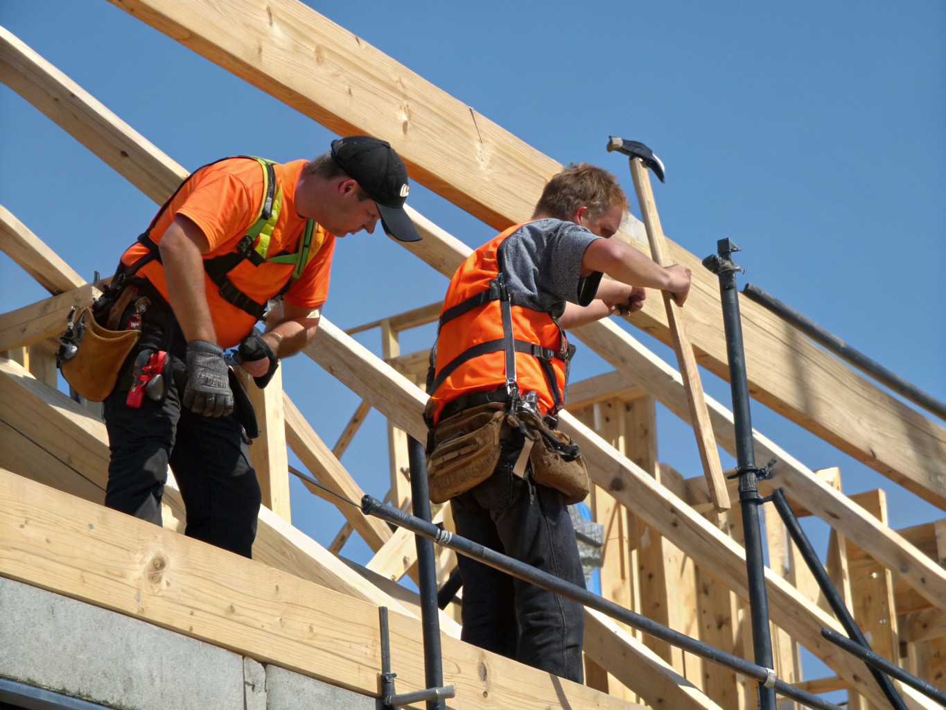 NB Improvements craftsmen on site installing timber framing
